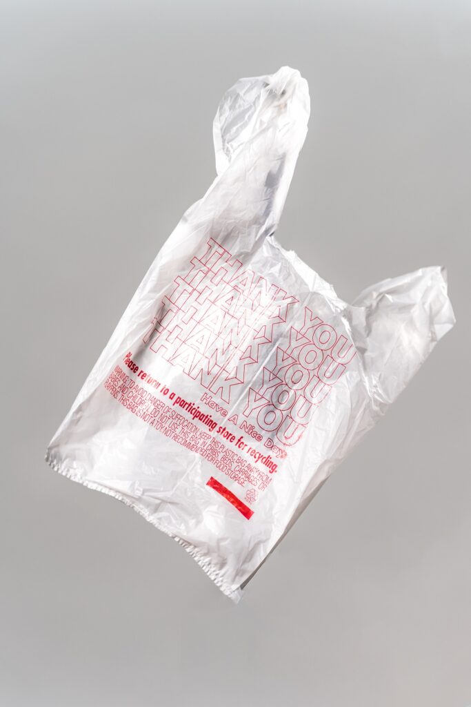 A recyclable clear plastic bag that has Thank You written on it several times.
